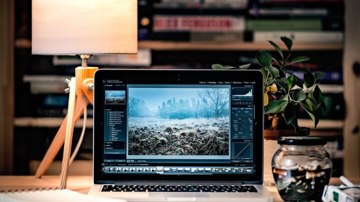 Laptop running creative software in a focused workspace