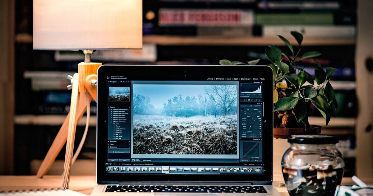Laptop running creative software in a focused workspace