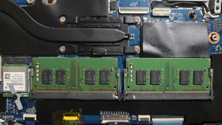 Two SODIMM RAM modules installed on a laptop motherboard with nearby cooling components.