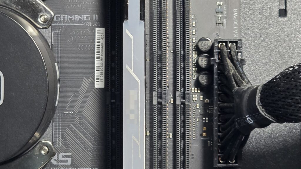 First DDR4 RAM module fully seated in the motherboard DIMM slot with retaining clips locked into place.