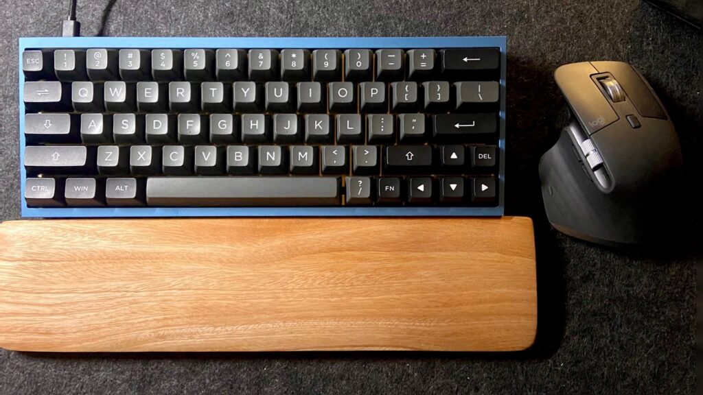 Modern Desk Setup with Tofu 60 and Logitech MX Master 3 and a wooden wrist rest