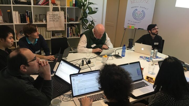 Group working together on laptops during a collaborative technology workshop